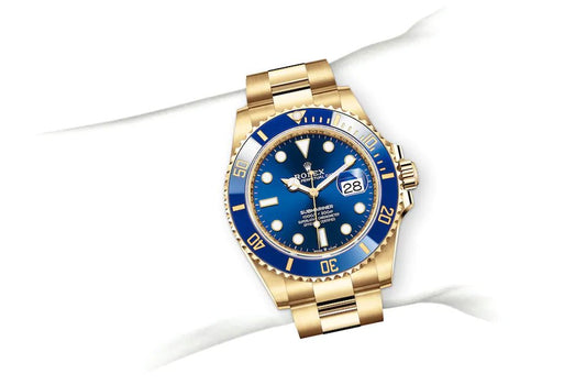 Rolex Submarine yellow gold and a blue dial date comInline Delivery Info