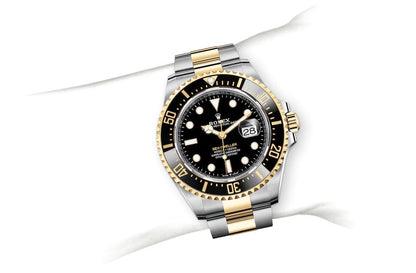 Rolex Sea-Dweller yellow gold Bezel and black dial comInline Delivery Info