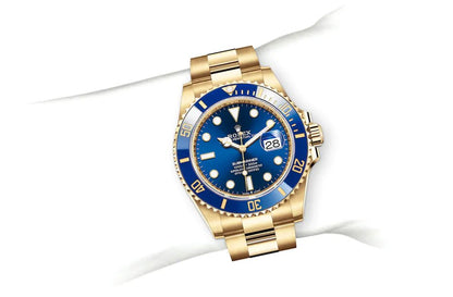 Rolex Submarine yellow gold and a blue dial date  comInline Delivery Info